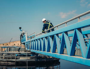 Employee looks over wastewater treatment facility 